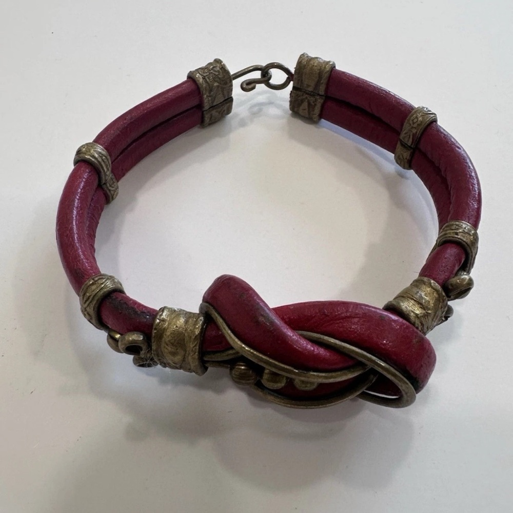 Brass and Gold Tone Accented
Wrapped Leather Bracelet.